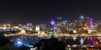 The Pittsburgh skyline across the Mon river at night